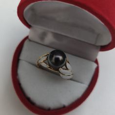 Pearls Are Having Such A Moment And I'm Here For It Bringing You This Lovely Vintage/Antique Gold Piece. The Ring Features A Beautiful Black Pearl Nestled Among Waves Of White Enamel. The Enamel Is Asymmetrical, Giving This Piece A Very Avant Garde Look. The Piece Bears 3 Hallmarks, Which I've Yet To Investigate. 14k Gold. Approximately A 6.25-6.5. Some Wear To The Enamel As Shown, Piece Is Quite Old. A Very Hefty, Thick Ring. Old A, Gold Pearl Ring, Thick Ring, Gold Piece, Black Pearl, Gold Pearl, White Enamel, Pearl Ring, Womens Jewelry Rings