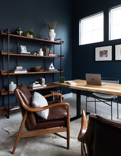 a living room filled with furniture and a book shelf