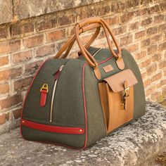 Ideal for overnight or weekend trips, the travel duffle is the best option to carry all your essentials in style. There’s virtually no place where a leather duffel bag would feel awkward or out of place. It measures 21.6 x 11.8 x 11.0 inches / 55 x 30 x 28 cm and features an outside pocket perfect for the little items that could otherwise get lost at the bottom of your bag, full lined interior and a removable shoulder strap. THE DETAILS: Materials: flannel green + med brown painted calf + red pa Leather Duffle Bag Men, Leather Duffel Bag, Green Flannel, Leather Duffel, Luggage Bags Travel, Leather Duffle Bag, Leather Travel Bag, Leather Duffle, Travel Duffle