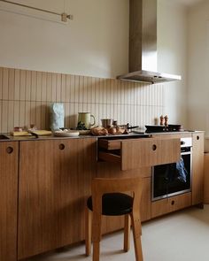 a kitchen with wooden cabinets and an oven