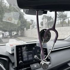 the dashboard of a car with a stethoscope attached to it