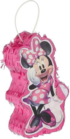 a pink minnie mouse ornament hanging from a string on a white background,