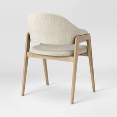 an upholstered chair with a wooden frame and fabric seat, viewed from the front