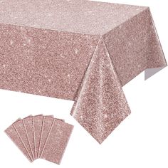 pink glitter tablecloths with matching napkins and placemats on white background