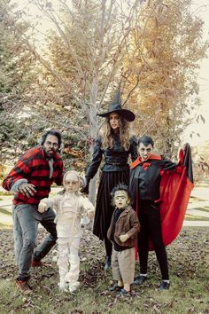 a family dressed up for halloween posing for a photo