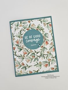 a handmade card with the words be of good courage written in blue on it