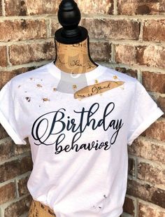 a white shirt with the words birthday is shown on a mannequin