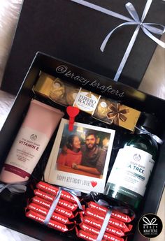 an open gift box filled with personal care products and gifts for someone's special occasion