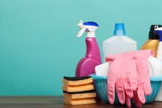 cleaning supplies and sponges sit on a table