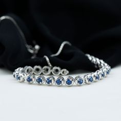 Product Details This Tennis Chain Bracelet is perfectly decorated with round shape Created Blue Sapphire in a semi eternity style in a Prong Setting. This Rope Chain Bracelet will magnify the beauty of your wrist and make your wrist glossy. Product Information SKU SHP-BRACELET0621104297 Length 177.8 mm Width 3.8 mm Height 3.2 mm Weight 6.56 gm (Approximate) LAB CREATED BLUE SAPPHIRE INFORMATION No.of Stones 23 Pieces Total Weight 3.45 Carat (Approximate) Dimension(approx) Round-3X3 mm-23 Pcs Col Round Sapphire Bracelet, Formal Sapphire Round Bracelets, Formal Round Sapphire Bracelet, Fine Jewelry Sapphire Bracelets, Sapphire Tennis Bracelet With 17 Jewels, White Gold Diamond Bracelet With Gemstone, Fine Jewelry Blue Diamond Cut Bracelets, Blue Diamond Bracelet In Prong Setting, Fine Jewelry Blue Diamond Cut Bracelet