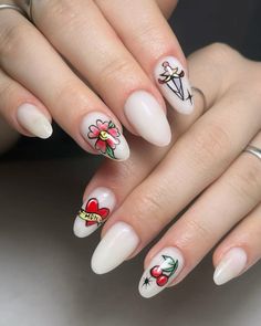 a woman's hands with white manies and flowers on them