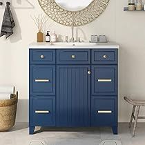 a bathroom with a blue cabinet and mirror