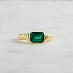 Beautiful Emerald Ring that makes a statement! It is still very delicate, but certainly stands out beautifully! ☆ Details ☆ * Made of 925 Sterling Silver * Available in 14k Gold Plating or Rhodium * We use a THICK 14k Gold plating - for a piece that will last you years to come! * VERY HIGH QUALITY * Made of the highest grade of cubic zirconia stones for an authentic look * Available in sizes 4, 5, 6, 7, 8, 9, or 10 ✈️ READY TO SHIP! Ships out same day, for quick delivery. Domestic Orders arrive Simple Emerald Ring, Emerald Statement Ring, Emerald Engagement Ring Green, White Stone Ring, Smaragd Ring, May Birthstone Rings, Emerald Ring Gold, Green Rings, Gold Statement Ring