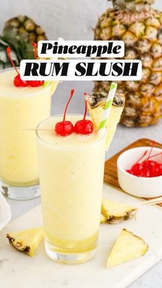 pineapple rum slush in glasses with cherries on the rim