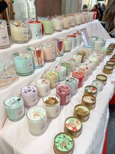 many candles are lined up on a table