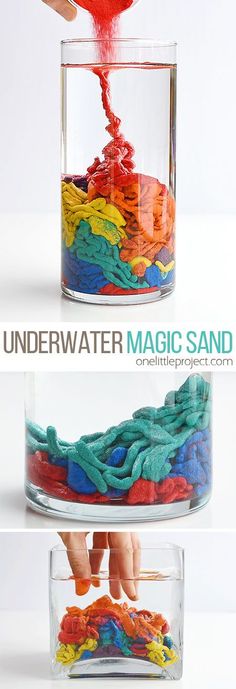 there is a glass container filled with different colored yarns in it and the words under water magic sand