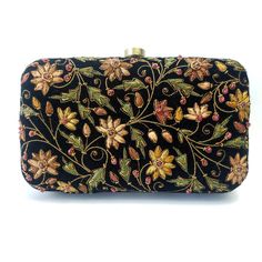 "Beautiful designer luxury black velvet hard case clutch bag, hand embroidered with a rich palette of caramel colored flowers and embellished with ruby gemstones. This will be your go to purse for any wedding! A classic design that never goes out of style. Expertly hand embroidered by third generation zardozi artisans. The word Zardozi means \"gold thread\". It is an elaborate and intricate multidimensional embroidery using metallic threads and genuine precious and semi precious gemstones. A cen Wedding Guest Clutch, Velvet Clutch Bag, Embellished Purses, Flowers Luxury, Designer Clutch Bags, Pink And Lavender, Floral Clutches, Velvet Clutch, Floral Handbags