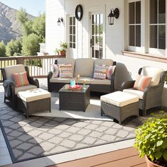 an outdoor living area with furniture and potted plants on the patio, overlooking mountains