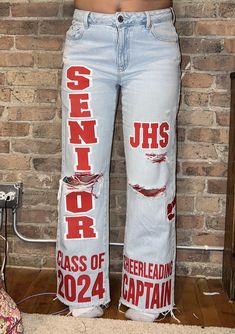 Please message me before purchasing so we can discuss your vision for your custom jeans. I will then let you know which option to choose when checking out! Price is based off of the amount of time it will take me to make your jeans. (price does not include the jeans, only the customization) Senior Jeans Orange And Blue, Junior Year J Ideas, Senior Hoco Jeans Ideas, Custom Senior Jeans, Senior Jeans Red And Black, Custom Senior Pants, Diy Senior Jeans, Spirt Pants, Senior Pants 2025