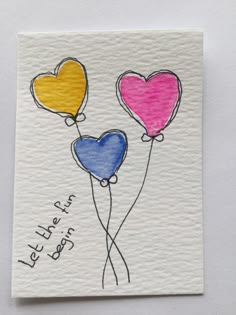 three heart shaped balloons with the words let there be love written on each balloon in blue, yellow and pink