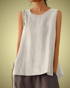 Embrace effortless style and comfort with the PRAGUE Linen Top, a perfect blend of simplicity and elegance. This sleeveless linen tank top features a classic round neck and an oversized fit, making it an ideal choice for casual wear. Crafted from a soft cotton-linen blend, it offers breathability and ease, perfect for warm weather. Whether you're going for a laid-back look or dressing up for an outing, this retro-inspired top is versatile and timeless. Premium Linen-Cotton Blend: Soft and breathable fabric for ultimate comfort. Sleeveless Design: Ideal for layering or wearing on its own in warm weather. Round Neck: Classic and flattering neckline that suits any style. Oversized Fit: Relaxed and comfortable, perfect for a casual, chic look. Retro Style: Vintage-inspired design that adds a t Relaxed Fit Sleeveless Top With Pockets, Sleeveless Relaxed Fit Tops In Plain Color, Versatile Sleeveless Solid Color Top, Solid Color Linen Sleeveless Tank Top, Solid Linen Sleeveless Tank Top, Sleeveless Linen Tank Top, Casual Sleeveless Solid Color Blouse, Casual Sleeveless Blouse For Everyday, Casual Sleeveless Everyday Blouse