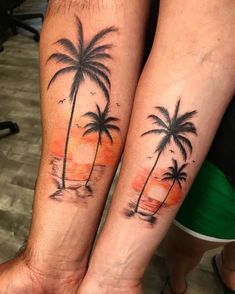 two people with matching tattoos on their arms, one has a palm tree and the other has