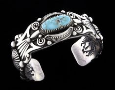 Artisan Turquoise Engraved Bracelet, Artisan Turquoise Engraved Bracelets, Blue Stamped Bracelet As Gift, Turquoise Stamped Bracelet, Stamped Turquoise Bracelet, Oval Turquoise Collectible Bracelet, Stamped Turquoise Bracelet As Gift, Artisan Engraved Blue Bracelets, Artisan Blue Stamped Bracelets