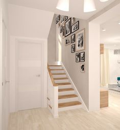 a staircase with pictures hanging on the wall