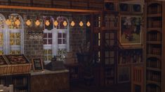 a room filled with lots of books and furniture next to a wall covered in windows