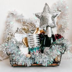 a basket filled with silver and white decorations