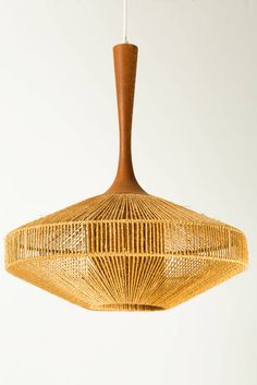 a wooden light fixture hanging from a ceiling