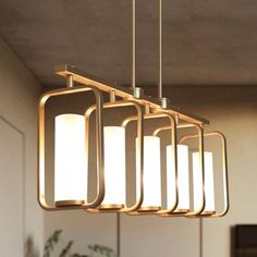 a rectangular light fixture hanging over a dining room table