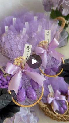 two baskets filled with purple flowers next to each other