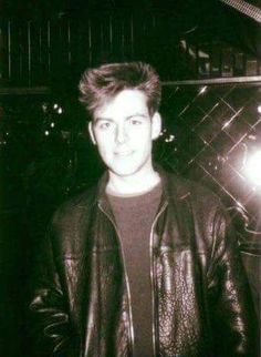 black and white photograph of a man wearing a leather jacket