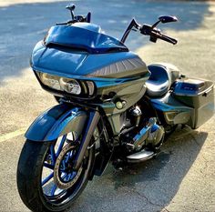 a blue motorcycle is parked on the street