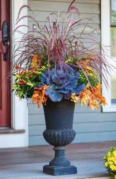 a large planter filled with lots of colorful flowers