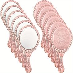 a set of six pink mirrors sitting next to each other