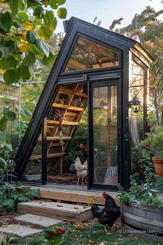 a small greenhouse with chickens in it and stairs leading up to the top floor, surrounded by greenery