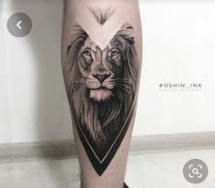 a man's leg with a lion tattoo on it