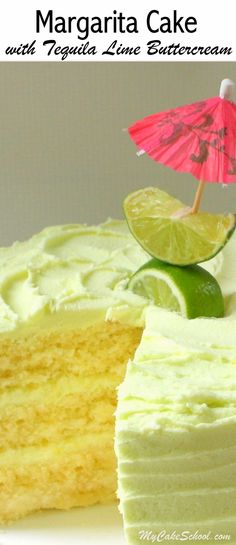 there is a piece of cake with lime on it and an umbrella in the background