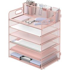 a pink desk organizer with lots of items on it's sides and drawers in the middle