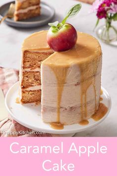 a cake with caramel icing and an apple on top is sitting on a plate