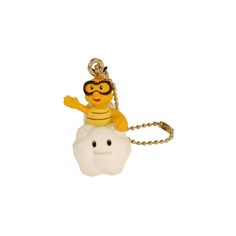 a keychain with a yellow bee on top of a white cloud and wearing a safety goggles