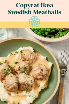 a green plate topped with meatballs covered in gravy next to some peas