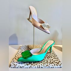 Gianvitto Rossi Refreshes The Signature Jaipur Mules With This Satin Iteration. Resting Atop 85mm Stiletto Heels, The Pointed Silhouette Is Accented By A Square-Shaped Crystal And Satin Material/Construction. These Elegant Mules Are Quintessential Sophistication That Gianvito Rossi Is Known For! Luxury Green Heels For Cocktail, Elegant Green Heels For Evening, Elegant Green Evening Heels, Green Pointed Toe Heels For Cocktail, Elegant Green Heels With 4-inch Heel, Chic Green Heels For Events, Elegant Green Heels With Padded Heel, Chic Green Heels For Cocktail, Elegant Green Heels For Events