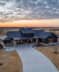 this is an aerial view of a house in the country side with a walkway leading up to it