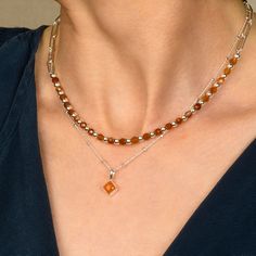 A perfect and unique birthstone gift for those born in July. The diamond-shaped cut Carnelian gemstone is handset into high-quality sterling silver with an 18" eco-silver satellite chain, creating a durable and long-lasting accessory. Each necklace is carefully crafted by skilled artisans with utmost care and attention to detail, making it a rare and beautiful piece of birthstone jewellery.  Carnelian: stimulate creativity | motivation | reduce fatigue We want your jewellery to stay in great con Elegant Everyday Birthstone Necklace With Natural Stones, Elegant Birthstone Necklace With Natural Stones For Everyday, Modern Jewelry With Gemstone Beads For Gifts, Modern Gemstone Beads Jewelry For Gifts, Modern Gemstone Beads Jewelry As Gift, Gold Carnelian Jewelry With Polished Finish, Modern Gemstone Beads Jewelry Gift, Fine Jewelry Amber Birthstone, Amber Birthstone Fine Jewelry