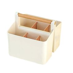 a white container with three compartments and a wooden handle