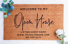 a welcome mat with the words open house on it