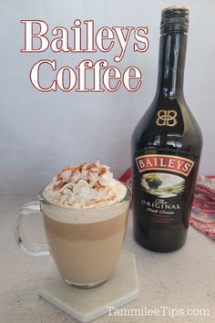 bailey's coffee is served in a glass mug with whipped cream